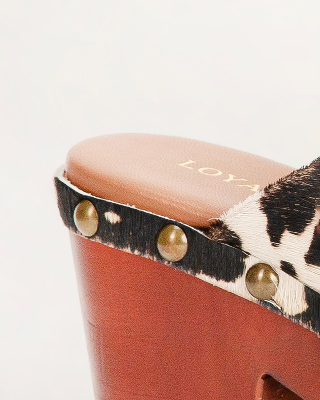 CARLOTTA TRAIL CLOGS BLACK AND WHITE COWHIDE