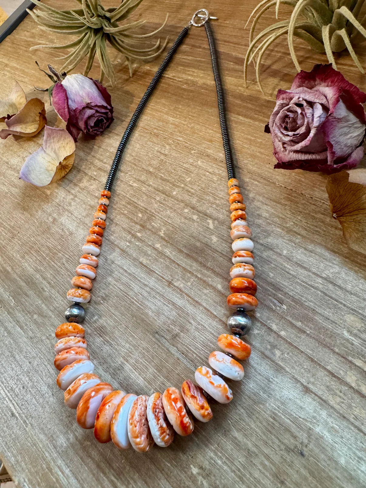 23 inch Graduated Orange Spiny
Necklace with Sterling Silver
Pearls