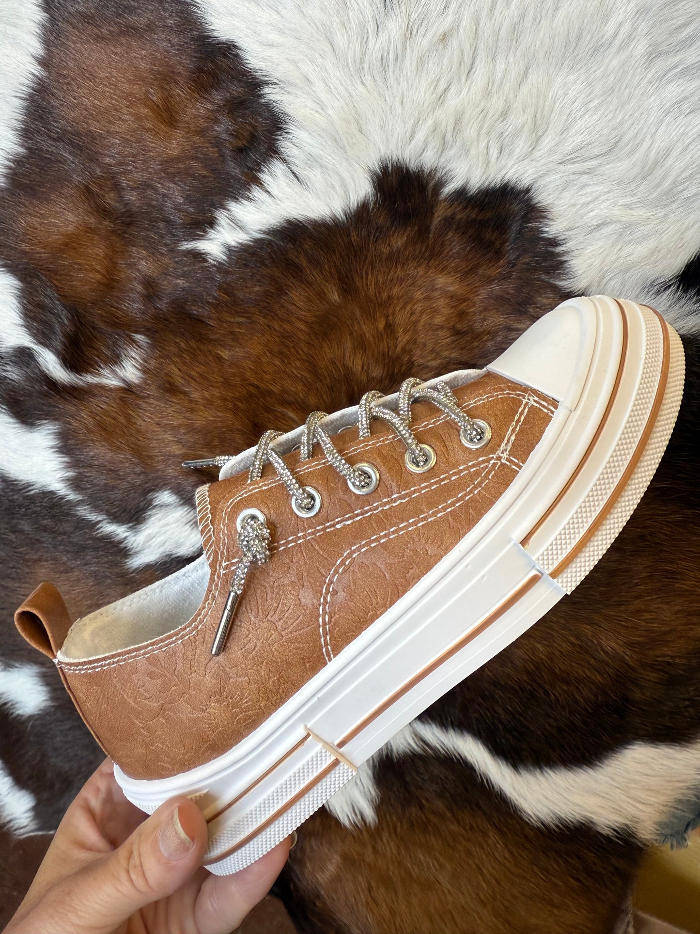 Madeline Tooled Floral
Embossed Slipon Sneaker