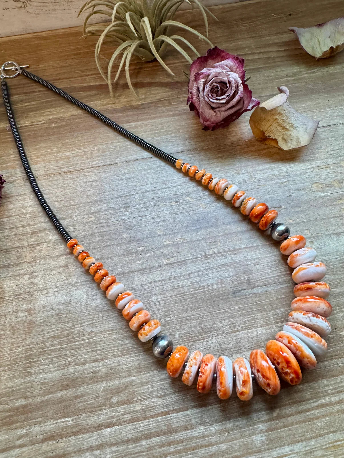 23 inch Graduated Orange Spiny
Necklace with Sterling Silver
Pearls