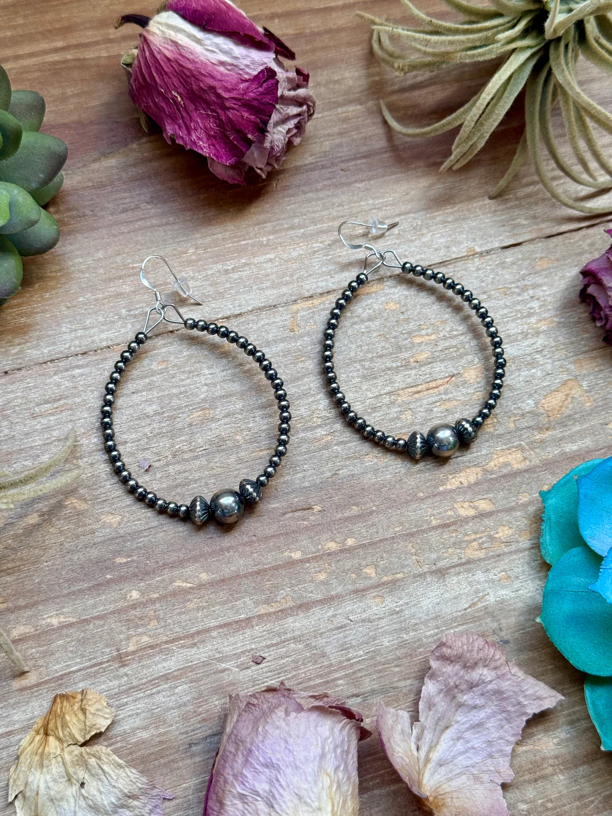 Sterling Silver Pearl Hoop
Earrings - 8 mm in the middle