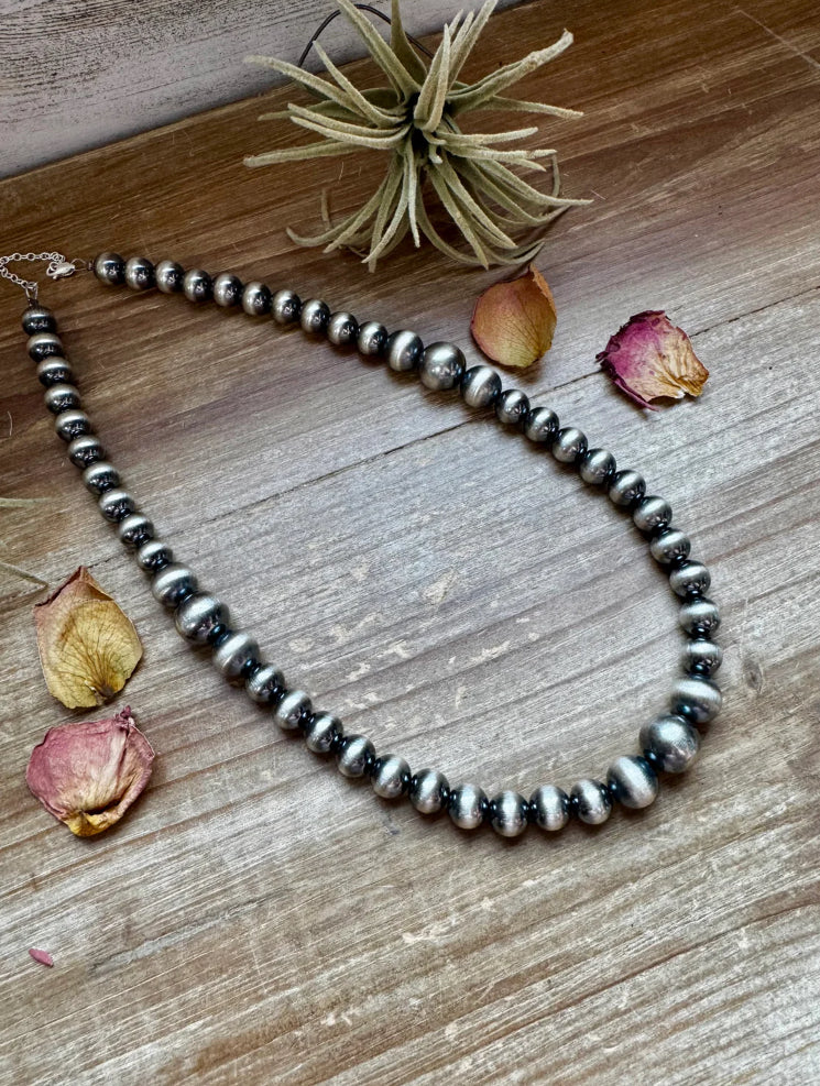 1/2 inch graduated 10 to
14 mm Sterling Silver Pearls necklace